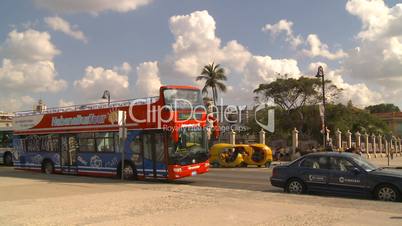 Havana orange taxi and bus