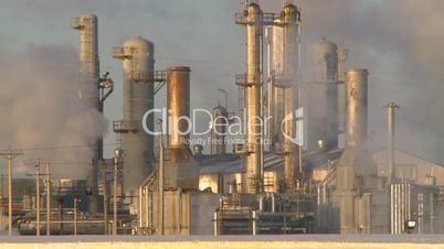 Gas plant at sunrise steam