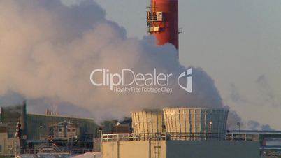 Gas plant at sunrise stacks