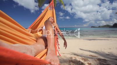 young woman in hammock close wideangle