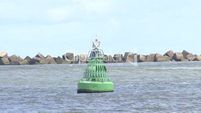 green buoy floating