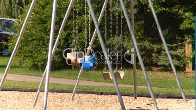 empty kids playground swing set