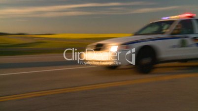 Police cars on highway fast