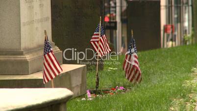 US flags cemetary tombstone