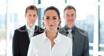 Beautiful businesswoman in front of her team
