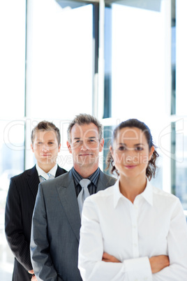 Matureusinessman in a line with his business team