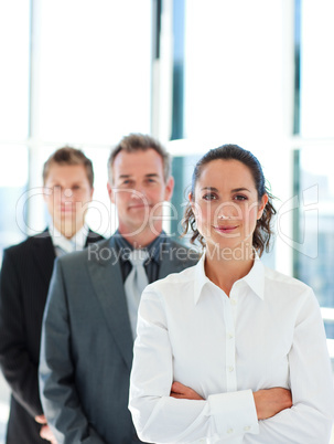 Friendly businesswoman in front of her team