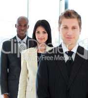 Young businesswoman in focus with her team