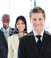 Smiling businessman in front of his team