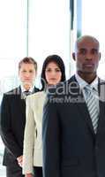 Serious businesswoman in focus with her team