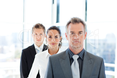 Businesswoman in focus with her team