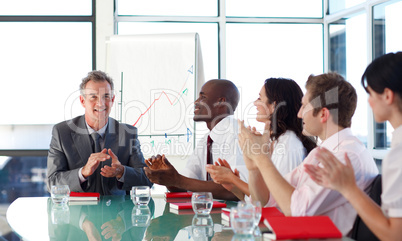 Business people applauding in a meeting