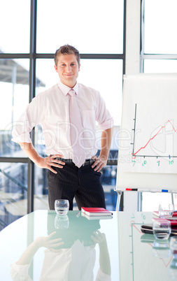 Young businessman standing in a presentation