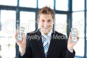businessman holding dollars