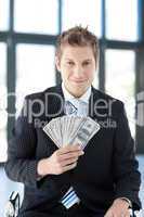 businessman showing dollars
