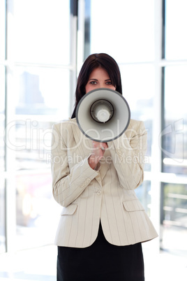 businesswoman shouting through megaphone