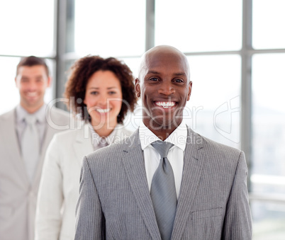 Smiling businessman with his team