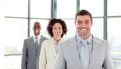 Smiling young businesswoman in a row