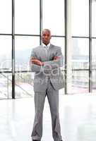 Serious businessman with folded arms