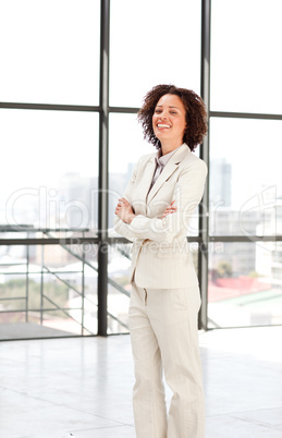 Attractive businesswoman with folded arms