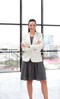 Beautiful smiling businesswoman with folded arms