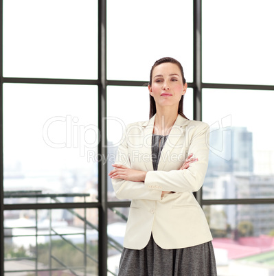 Beautiful confident businesswoman with folded arms