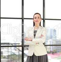 Beautiful confident businesswoman with folded arms