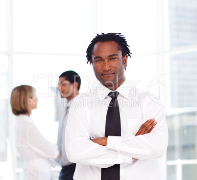 African businessman with folded arms