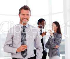 Young businessman in the office with his team