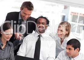 Multi-ethnic business team together in an office