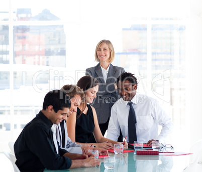 Female manager with her team in a meeting