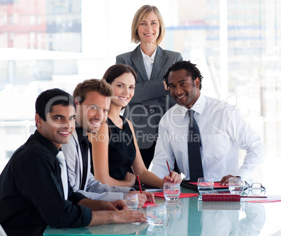 Business team smiling at the camera in office