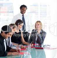 Businessman training a group of students in business