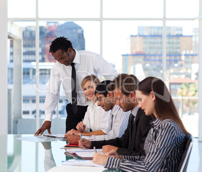 Afro-American manager working with his team