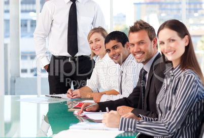 Business team working and smiling at the camera