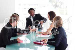 Business team drinking champagne in a meeting