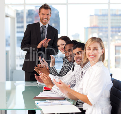 Business team clapping in a meeting