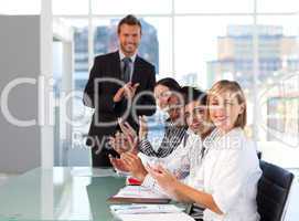Businessteam clapping at the end of a presentation