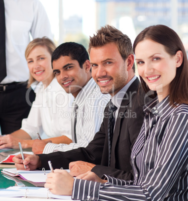 Businesswoman in an office with her colleagues