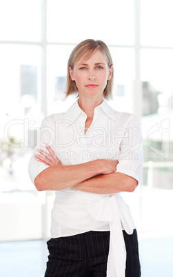 Serious businesswoman with folded arms