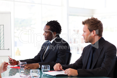 Businessmen sitting in a meeting
