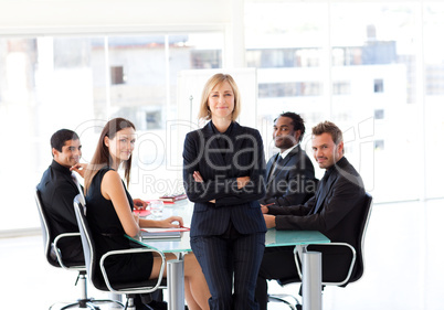 Business team smiling at the camera in an office