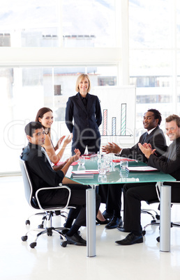 Businesspeople clapping in a presentation