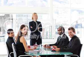 Businesswoman smiling at the camera in a meeting