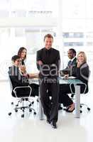 Confident businessman with folded arms in a presentation