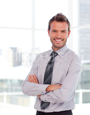 Handsome businessman with folded arms