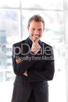 Attractive businessman smiling at the camera