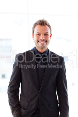 Young businessman smiling at the camera