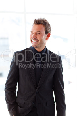 Smiling handsome businessman in office