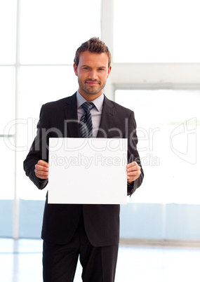 Friendly businessman holding a white card